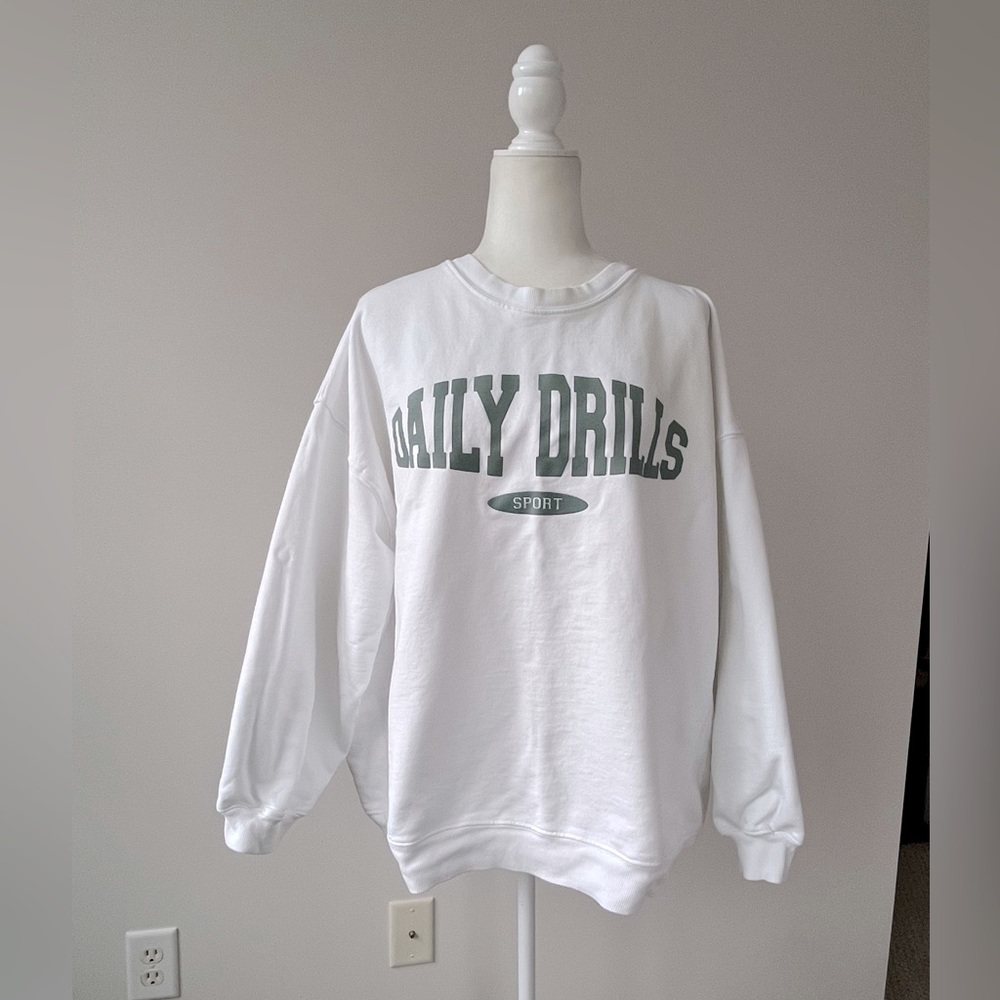 Daily Drills White Sweatshirt with Green Logo